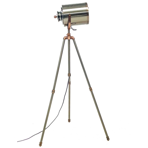 498 - A nautical or studio style standard lamp. Modern, with brushed chrome and copper finish, on a tripod... 