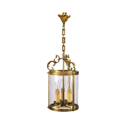 499 - A pair of circular glazed brass hall lanterns. 20th century, each with triple light fittings and C s... 