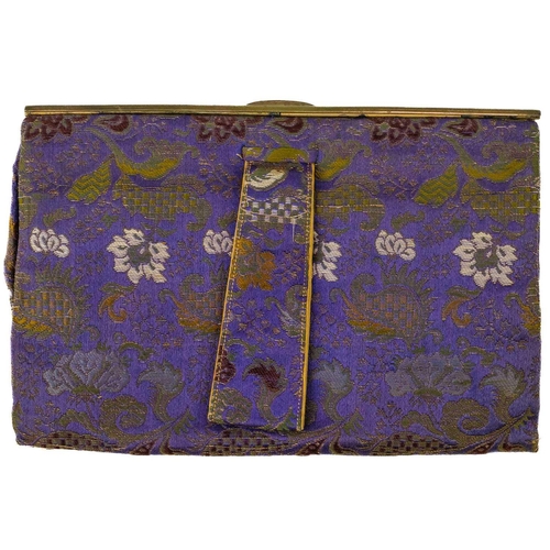 501 - A ladies Chinese clutch bag, embroidered in coloured and metallic silks. With a figure surrounded by... 