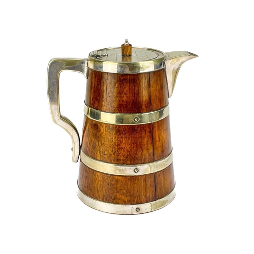 51 - An Edwardian oak coopered ale jug. Of tapered form with ceramic liner and silver plated mounts, heig... 