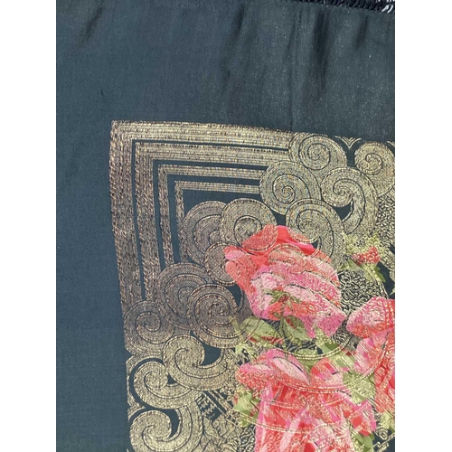 513 - A Chinese silk piano shawl. Machine embroidered with pink roses, figures and buildings, and with bla... 