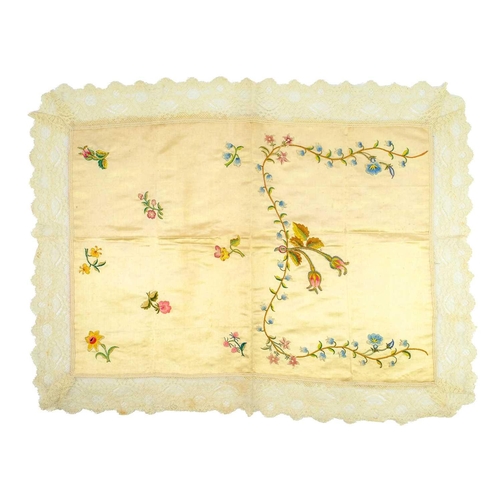 515 - An early 19th century embroidered silk panel. Decorated with flowers including roses, a daffodil, ho... 