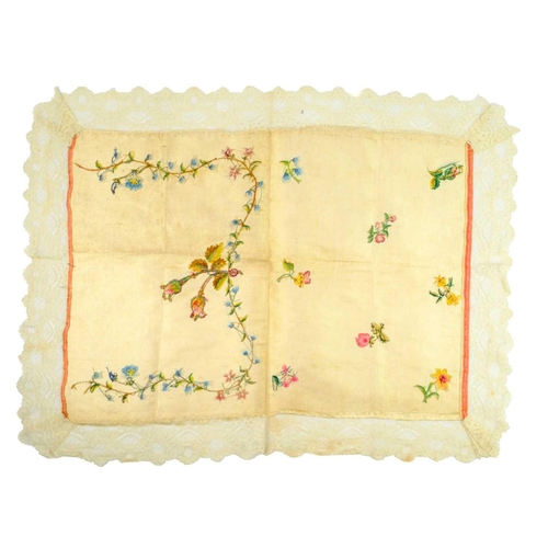 515 - An early 19th century embroidered silk panel. Decorated with flowers including roses, a daffodil, ho... 