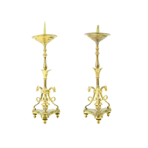 52 - A pair of brass pricket type ecclesiastical candlesticks. With a trefoil base, height 32cm.