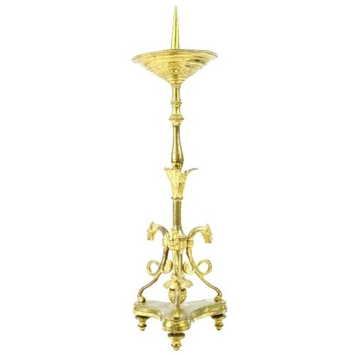 52 - A pair of brass pricket type ecclesiastical candlesticks. With a trefoil base, height 32cm.