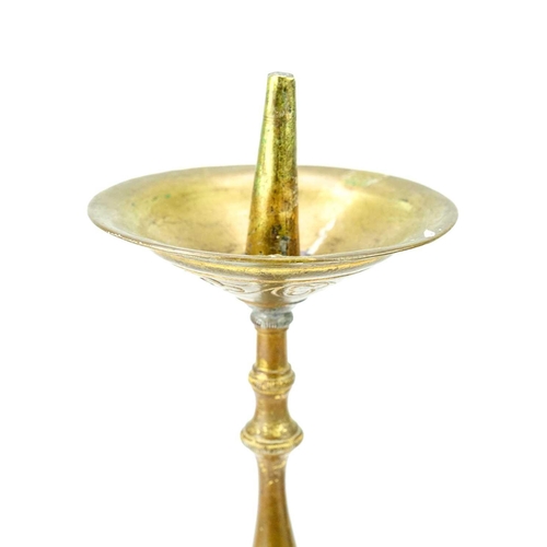 52 - A pair of brass pricket type ecclesiastical candlesticks. With a trefoil base, height 32cm.