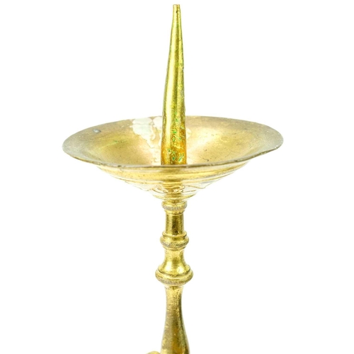 52 - A pair of brass pricket type ecclesiastical candlesticks. With a trefoil base, height 32cm.