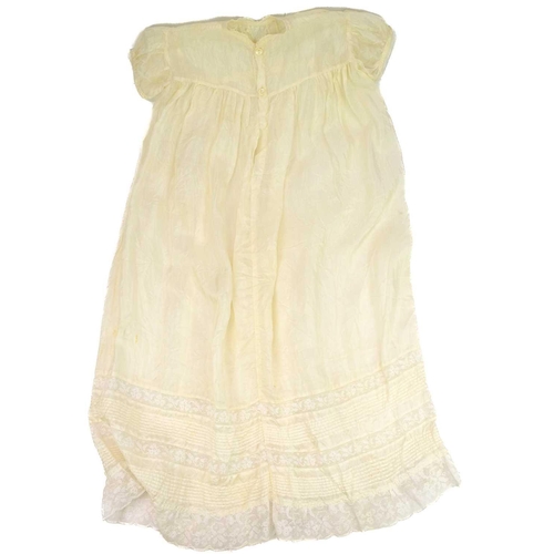 525 - A 19th century infant's silk and lace christening gown. Together with a silk and lace petticoat, and... 