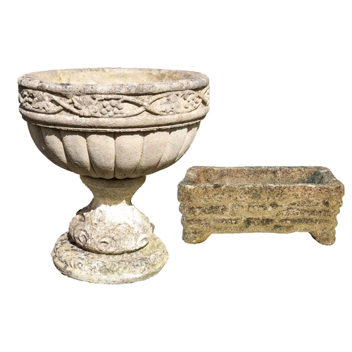 534 - A composition stone urn shape garden planter with fruiting vine decoration. Height 48cm, diameter 45... 