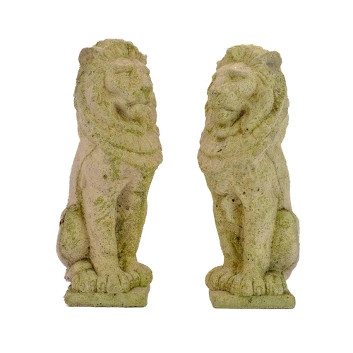 536 - Two reconstituted stone figures of seated lions. Height 34cm.