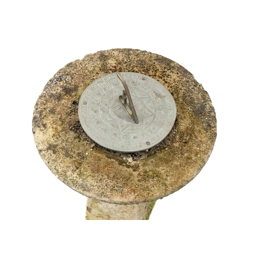 539 - A composition stone sun dial. Height 62cm.