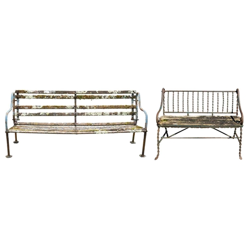 542 - A cast metal and slatted wood garden bench, and a wrought metal and slatted wood bench. 190cm and 12... 