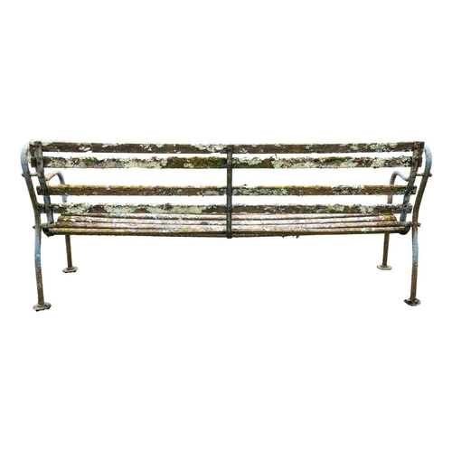 542 - A cast metal and slatted wood garden bench, and a wrought metal and slatted wood bench. 190cm and 12... 