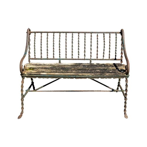 542 - A cast metal and slatted wood garden bench, and a wrought metal and slatted wood bench. 190cm and 12... 