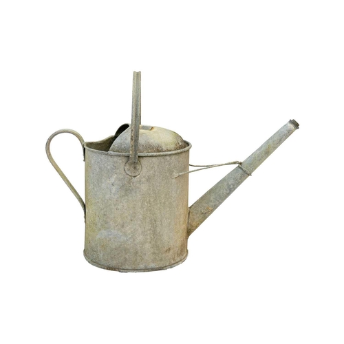 547 - A two gallon galvanised watering can. Together with four others (5). The watering cans are currently... 