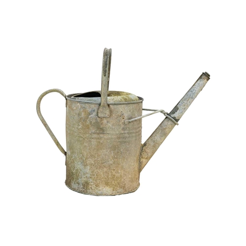 547 - A two gallon galvanised watering can. Together with four others (5). The watering cans are currently... 