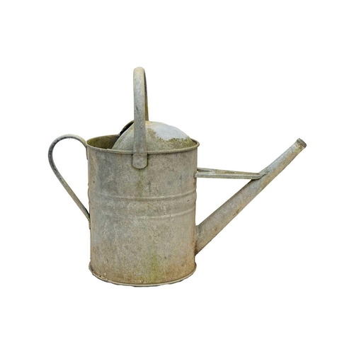 547 - A two gallon galvanised watering can. Together with four others (5). The watering cans are currently... 