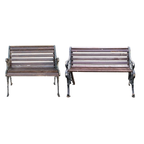 554 - A small cast iron garden bench, width 79.5cm. Together with another garden bench, width 119cm (2).