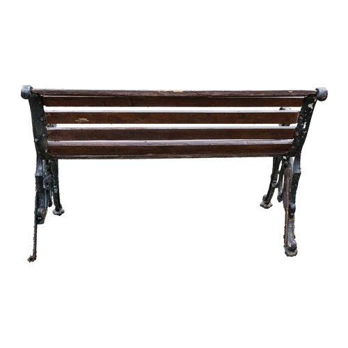 554 - A small cast iron garden bench, width 79.5cm. Together with another garden bench, width 119cm (2).