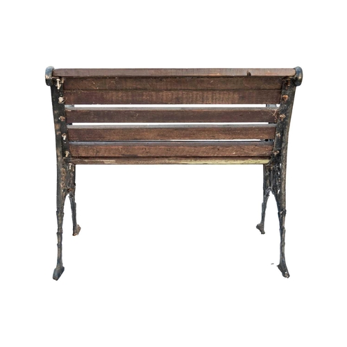 554 - A small cast iron garden bench, width 79.5cm. Together with another garden bench, width 119cm (2).