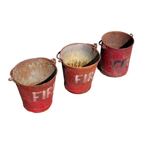 56 - Three red painted metal 'FIRE' buckets. All approximately 32cm tall.