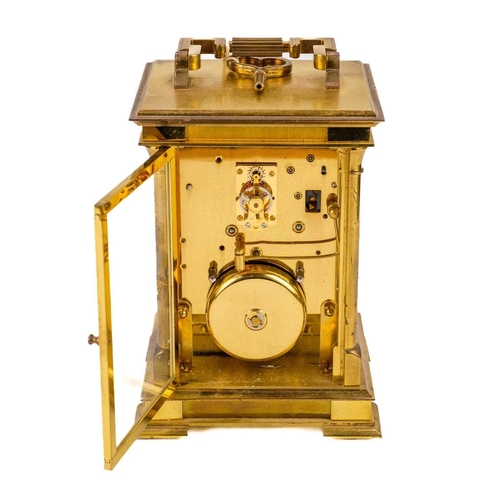 564 - An Angelus brass carriage clock. Maximum height 21cm.