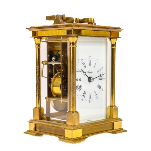 564 - An Angelus brass carriage clock. Maximum height 21cm.