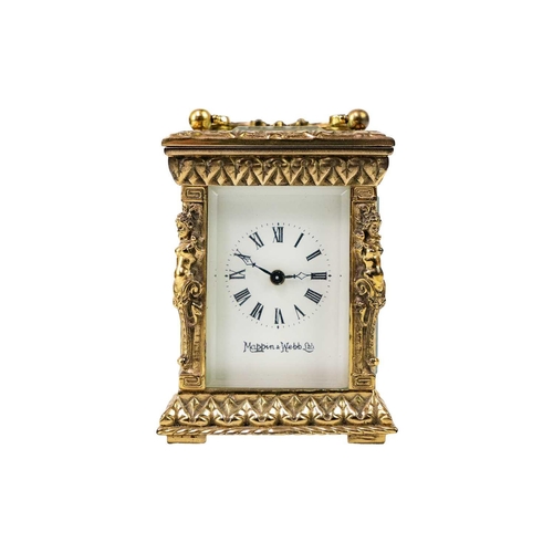 566 - A Mappin & Webb miniature carriage timepiece. Late 20th century, with cast brass case, height 8.2cm.