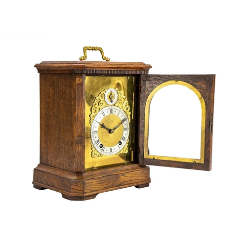 567 - A German Winterhalder and Hofmeier oak cased chiming bracket clock. The gilt mask with applied gilt ... 