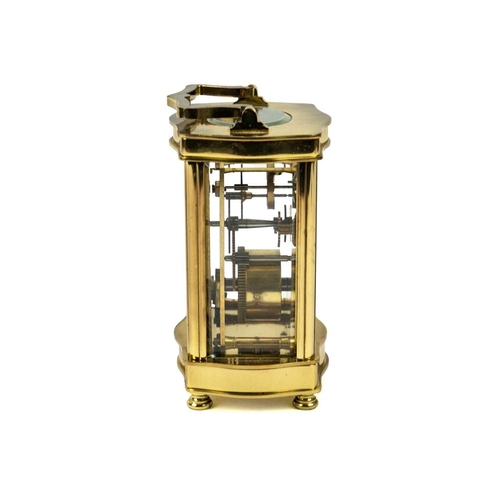 568 - A Diamond Boutique brass cased carriage clock. Circa 1988, the dial painted with a view of Windsor C... 