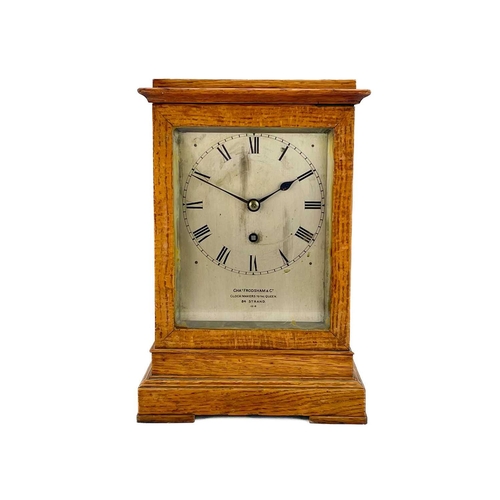 574 - A Charles Frodsham oak four-glass library timepiece. Mid to late 19th century, the silvered dial and... 