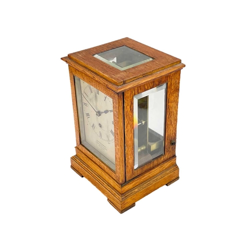 574 - A Charles Frodsham oak four-glass library timepiece. Mid to late 19th century, the silvered dial and... 