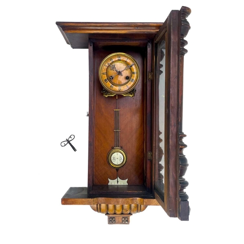 576 - A German Kienzle walnut cased wall clock. Striking on a coiled gong, height 68cm.