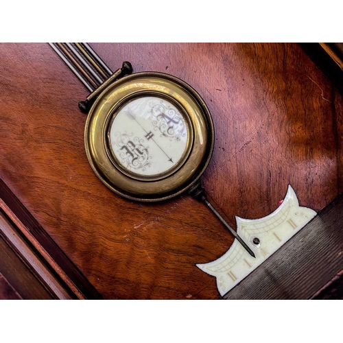 576 - A German Kienzle walnut cased wall clock. Striking on a coiled gong, height 68cm.