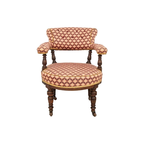 577 - A Victorian walnut upholstered tub chair. With turned supports and castor wheels, height 81cm width ... 