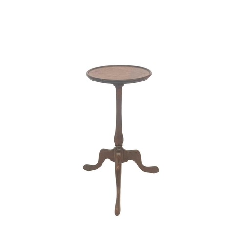 580 - A George III mahogany tripod table. With a dished tilt top, on a turned pillar, height 73cm, diamete... 