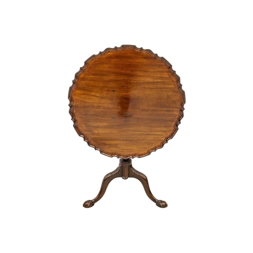 587 - George III style mahogany pie crust tilt top tripod table. 19th century, the turned and fluted pilla... 