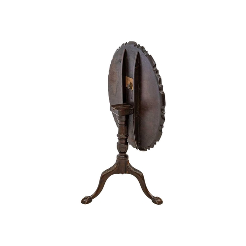 587 - George III style mahogany pie crust tilt top tripod table. 19th century, the turned and fluted pilla... 