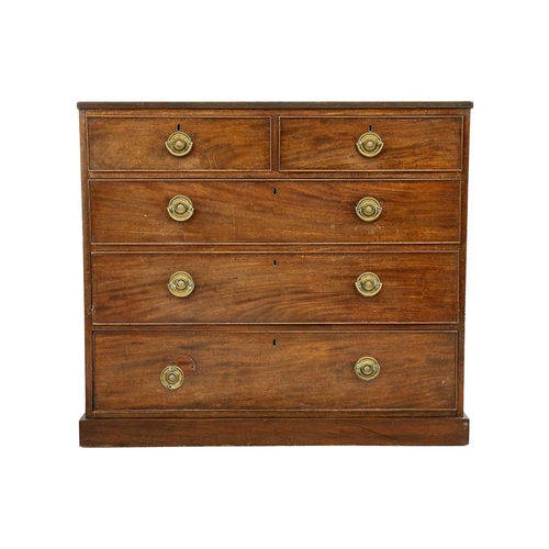 589 - A 19th century mahogany chest of drawers. With two short and three long drawers raised on a plinth b... 