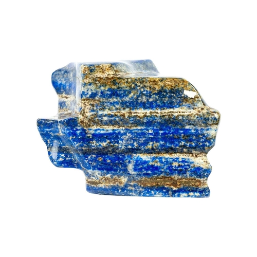 59 - A large lapis lazuli mineral specimen. A free standing, polished, free form lapis lazuli specimen, w... 