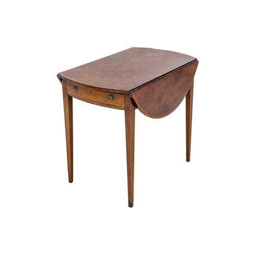 591 - A George III mahogany and kingwood banded oval Pembroke table. With an end drawer, and raised on squ... 