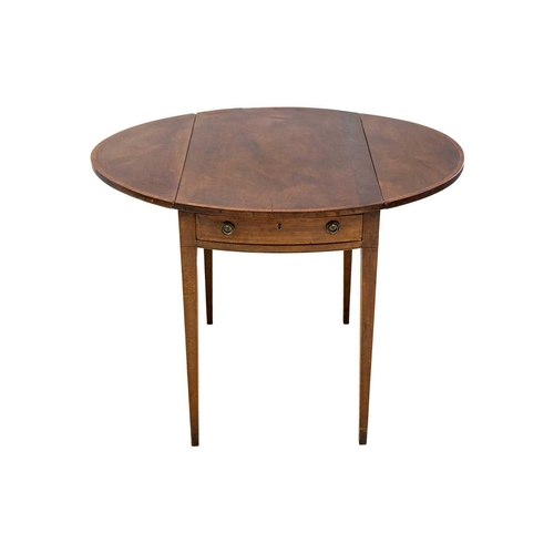 591 - A George III mahogany and kingwood banded oval Pembroke table. With an end drawer, and raised on squ... 