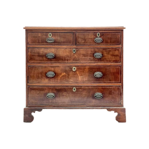 595 - A George III mahogany chest. Of two short and three long drawers, with boxwood and ebony stringing, ... 