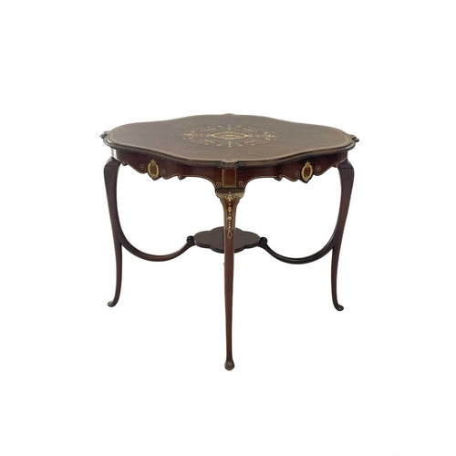 596 - A mid century Italian walnut quatrefoil centre table with bone and fruitwood inlay. With lower stret... 