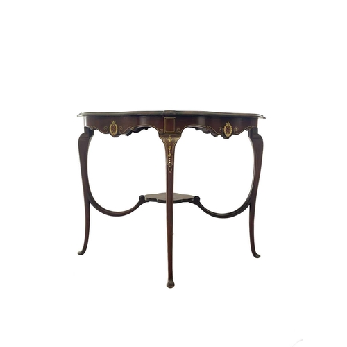 596 - A mid century Italian walnut quatrefoil centre table with bone and fruitwood inlay. With lower stret... 