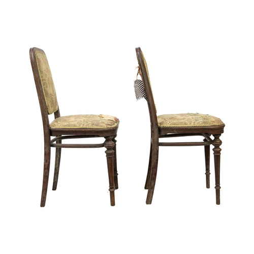 597 - A pair of early 20th century Thonet bentwood chairs. Both with paper labels, on turned supports. (2)