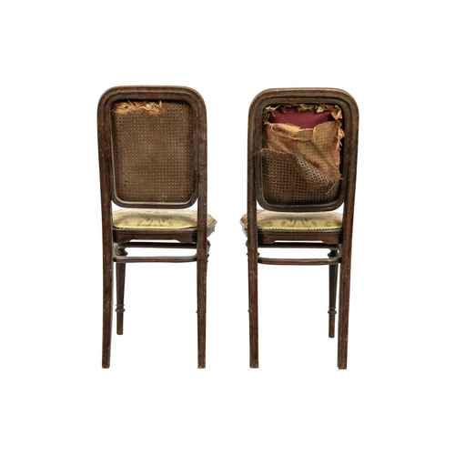 597 - A pair of early 20th century Thonet bentwood chairs. Both with paper labels, on turned supports. (2)