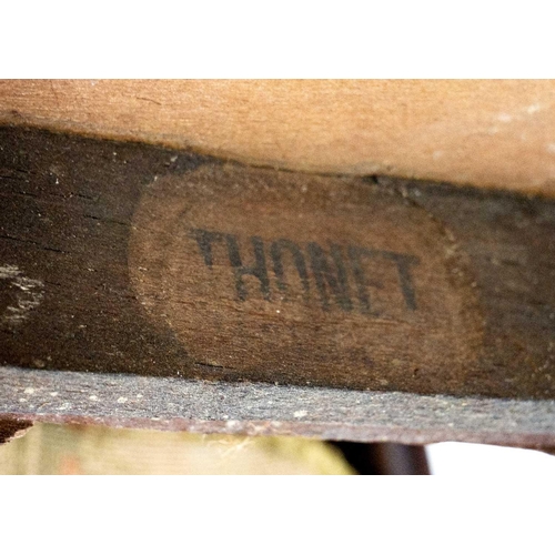 597 - A pair of early 20th century Thonet bentwood chairs. Both with paper labels, on turned supports. (2)