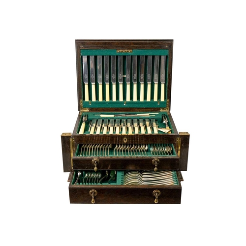 60 - An oak cased canteen of OE pattern cutlery 12 place settings ( a few deficient), in a two drawer cab... 