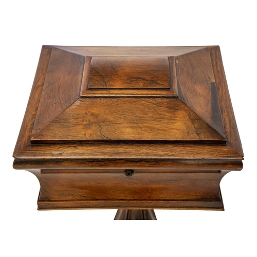 602 - A Victorian rosewood work box. The sarcophagus top with a pull-out tray, probably originally a teapo... 